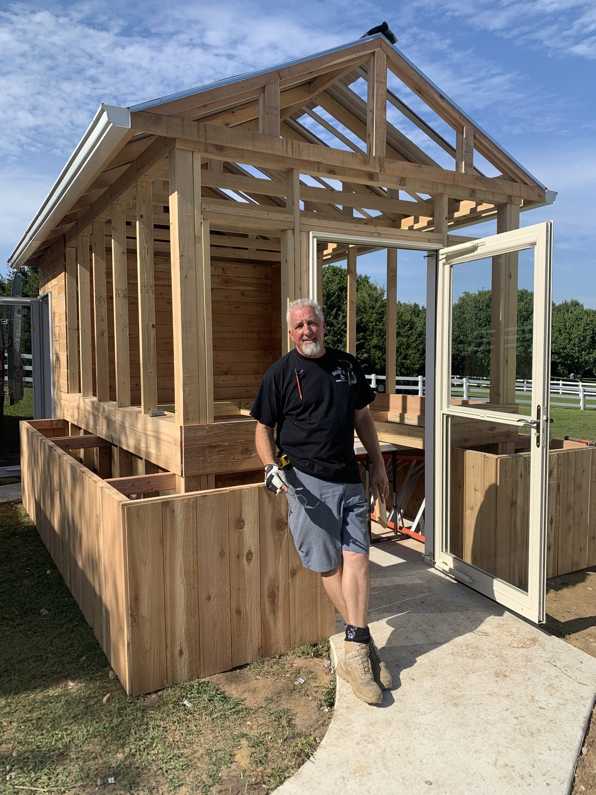 Rick Hopper building a cedar structure on his property
